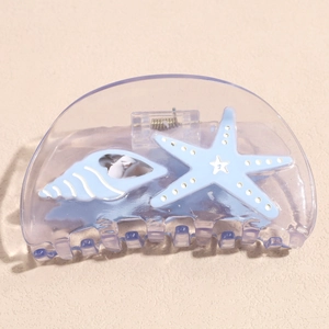 Detailed view of translucent purple sea snail and starfish acetate hair claw clip