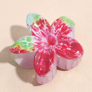 Detail view of large ABS floral hair claw clip with pink and green gradient spray finish