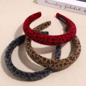 Three-piece leopard print plush headbands in red, brown, and grey soft faux fur finish