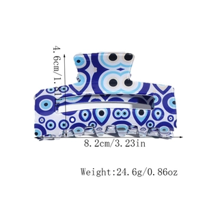 Detail view of the blue evil eye hair claw clip with specific dimensions and weight data