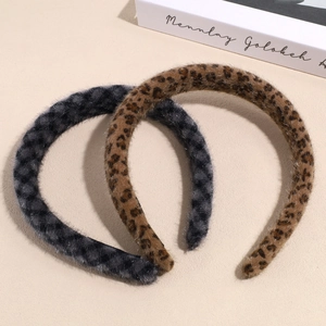 Vintage plush leopard print headbands in brown and grey for high-volume winter hair style