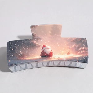 Detail of a large square hair claw clip featuring a festive Santa Claus snowy illustration