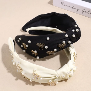 Set aus geknoteten Haarreifen in Schwarz und Creme mit Perlen und Gold-Schleifen