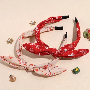 Set di cerchietti natalizi con fiocchi e stampe di Babbo Natale e fiocchi di neve rossi