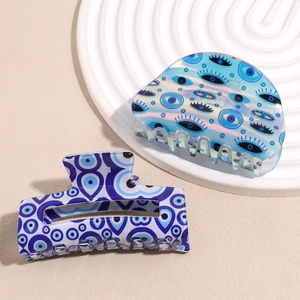 Retro evil eye hair claw clips in blue holographic and rectangular geometric design