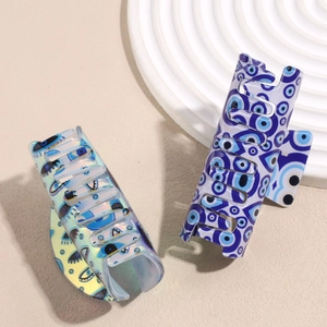 Dark aesthetic acetate eye-patterned and iridescent rectangle hair claw clips
