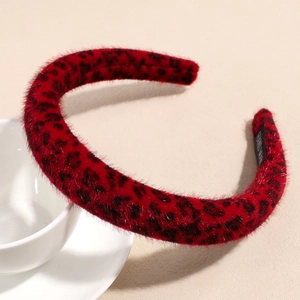 Detailed view of handmade red leopard print plush headband with soft faux fur texture
