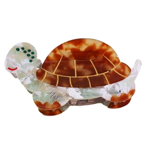 Cute tortoise shaped acetate hair claw clip with brown tortoiseshell and green pattern
