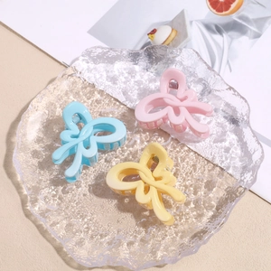 Three-piece set of sweet macaron candy color bow hair clips in blue, pink, and yellow