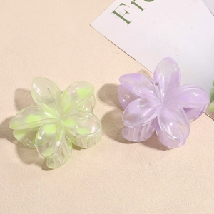 Set of two pastel flower hair claws in purple and green with matte pearlescent finish