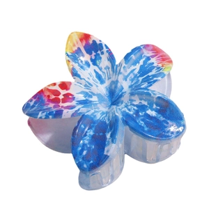 Elegant lily flower hair claw clip with colorful blue and red tie-dye floral pattern