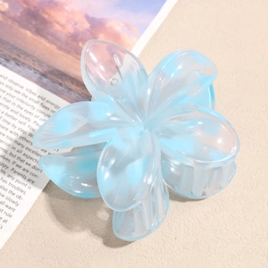 Detailed macro view of the icy blue marble floral hair claw clip on a stylish background