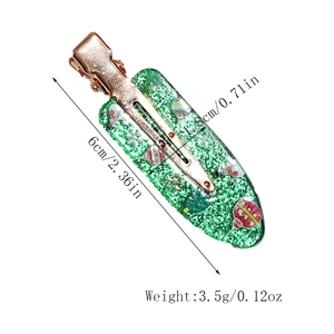 Christmas hair clip detail showing a 6cm green glitter resin deer candy hair accessory