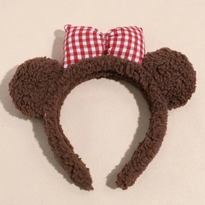Leopard print plush headband with red checkered bow and round ears detail
