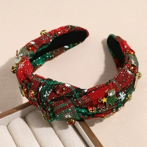 Detail of Christmas headband with red and green plaid fabric and festive tree charms