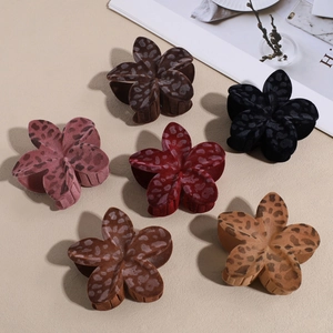 Set of six velvet leopard print flower hair claws in multiple earthy and neutral colors
