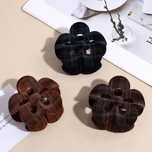 Three elegant flocked plaid flower hair claws in black and brown for women's hairstyles
