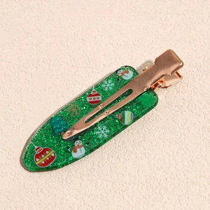 Christmas duckbill clip with green glitter resin and festive snowman pattern print