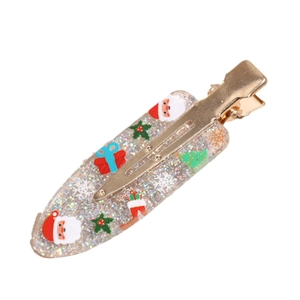 Christmas glitter hair clip with festive tree and Santa patterns on gold duckbill clip