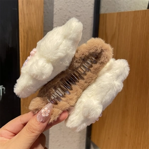 Cute plush bunny hair claw clip in white and brown fur for elegant autumn hairstyles