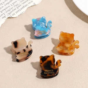 Set di quattro mollette per capelli a forma di gatto in acetato colorato e tartarugato