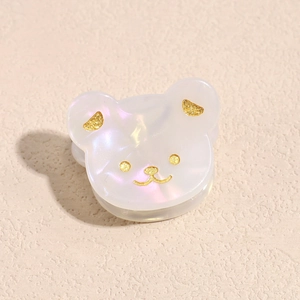 Macro di molletta per capelli a orsetto con trama in acetato perlato e dettagli glitter oro