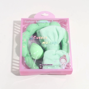 Mint green sponge headband and wristband set in pink display packaging box