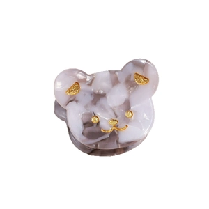 Mini molletta per capelli in acetato con viso di orso cartone e trama marmorizzata