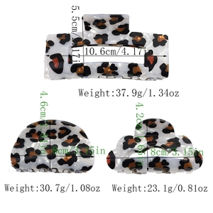 Detail showing the exact dimensions and weight for three leopard acetate hair claw clips