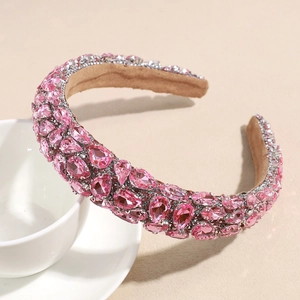 Macro shot of pink rhinestone headband with drop-shaped crystals and soft fabric lining