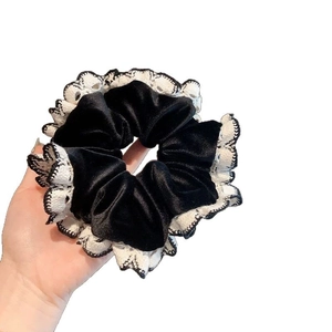 Retro black velvet scrunchie with cream lace trim for women's hair styling