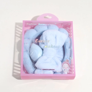 Light blue sponge headband and wristband set with makeup egg in a pink gift box