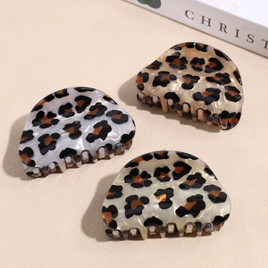 Three-piece leopard print acetate hair claw clips in grey, champagne, and cream colors