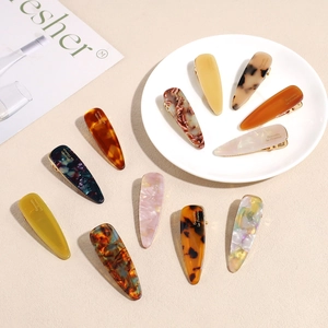 Set of 11 colorful acetate geometric hair clips with tortoiseshell and marble patterns