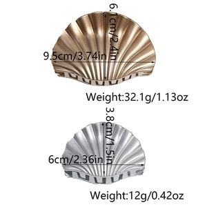 Detailed view of metal shell hair claws with precise size and weight measurements