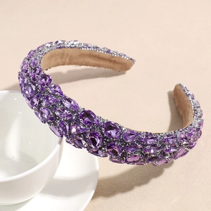 Macro detail of high-volume purple rhinestone headband with premium crystal embellishments