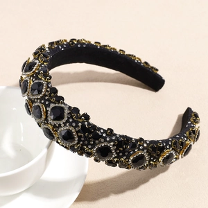 Detail of luxury padded headband featuring black gemstones and sparkling white crystals