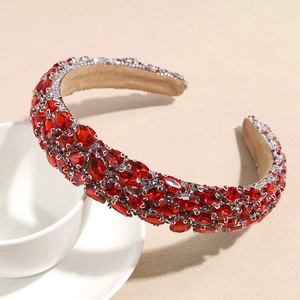 Close-up of luxury red rhinestones on padded headband with shiny crystals