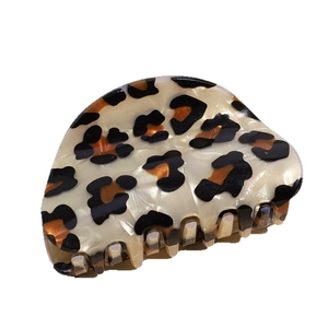 Leopard print acetate claw clip with translucent ivory base and sturdy grip teeth