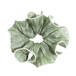 Pale green pleated scrunchie with white lace trim for elegant high ponytail hairstyles