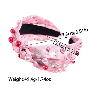 Rosa Stoffstirnband mit Bärenprints und Perlen, Maße 17,3 cm und 13,5 cm im Detail