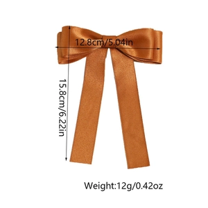 Detailed view of bronze satin bow hair clip with ribbons, sized 12.8cm by 15.8cm