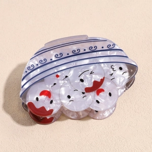 Macro view of Chinese style dumpling bowl hair claw clip with cute facial expressions