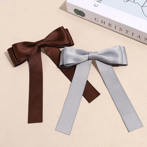 Elegant Maillard style bow hair clips in chocolate brown and silver grey satin finish