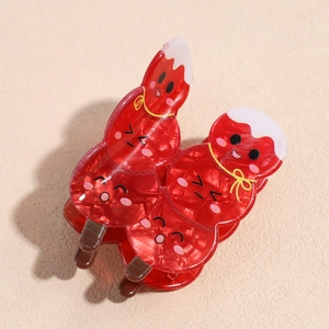 Detailed view of red acrylic hair claw with glossy glitter and cartoon snack design