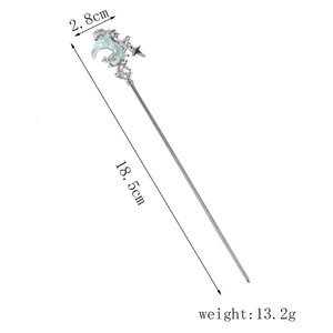 Detailed view of silver hair stick with crescent moon and star motif showing dimensions