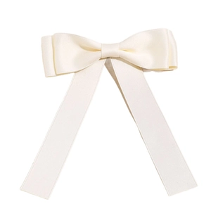 Elegant cream bow hair clip in satin fabric with long flowing ribbons for women