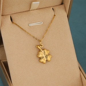 Irregular geometric four-leaf clover pendant necklace in gold stainless steel finish