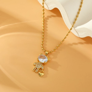 Goldene Bären-Halskette mit Zirkonia-Kristallen und Herzanhänger an einer Perlenkette