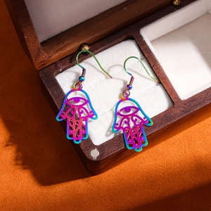 Rainbow plated stainless steel Hamsa earrings with hollow design and evil eye charms